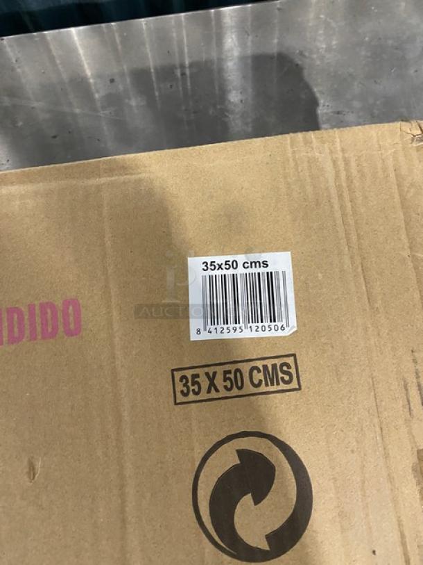 Brand new Guison commercial black enamelled cast iron plancha griddle, 35x50cm, in original packaging.