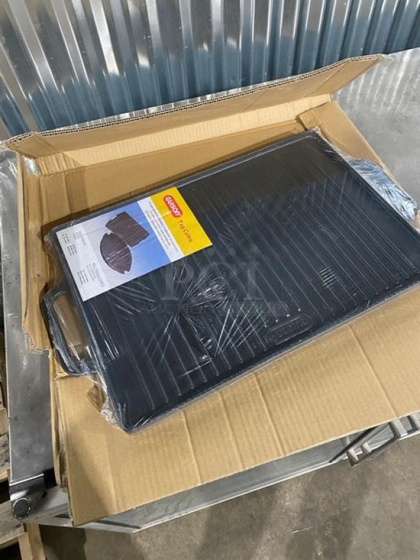 Brand new Guison cast iron griddle, 35x50cm, black enamel, in box. Features handles, ridged surface. Ideal for commercial use.