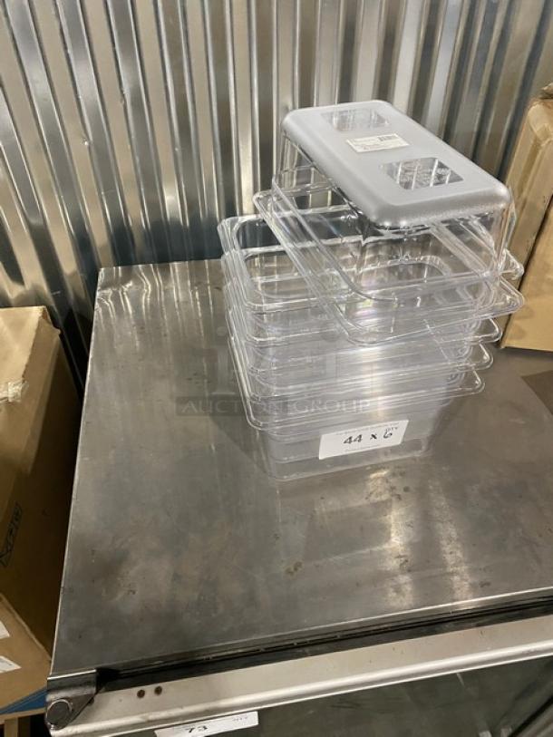 Winco SP7404 clear polycarbonate 1/4-size food pan, 4" deep, new condition, stack of pans on metal surface, auction lot label.