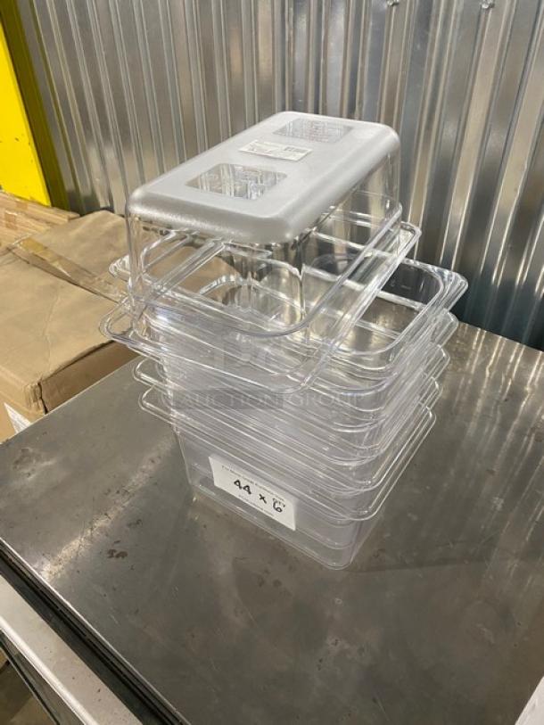 Winco SP7404 clear polycarbonate 1/4-size food pans, 4" deep, brand new, stacked on a metal surface.