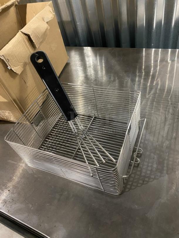 Brand new Waring LFB10 stainless steel fry basket, 9.5"x8"x4.5", with black grip handle, on a metal surface.