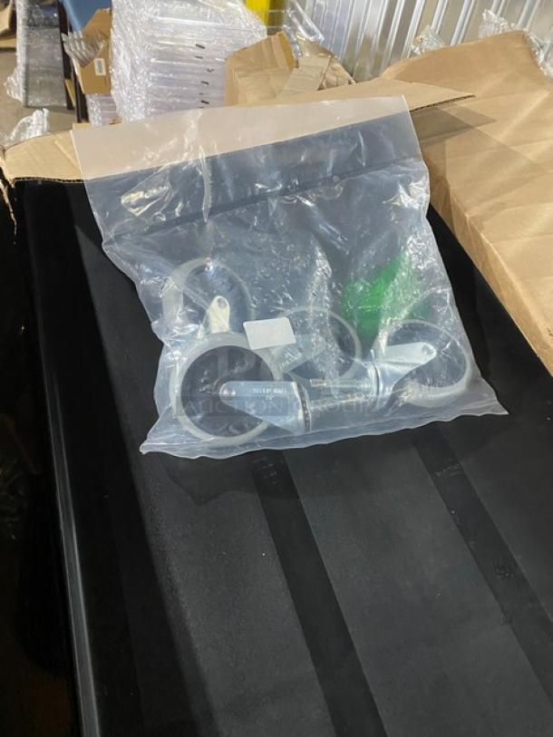 Brand new Rubbermaid Commercial black 3-tier utility/bus cart with casters, open-sided design, in original packaging.