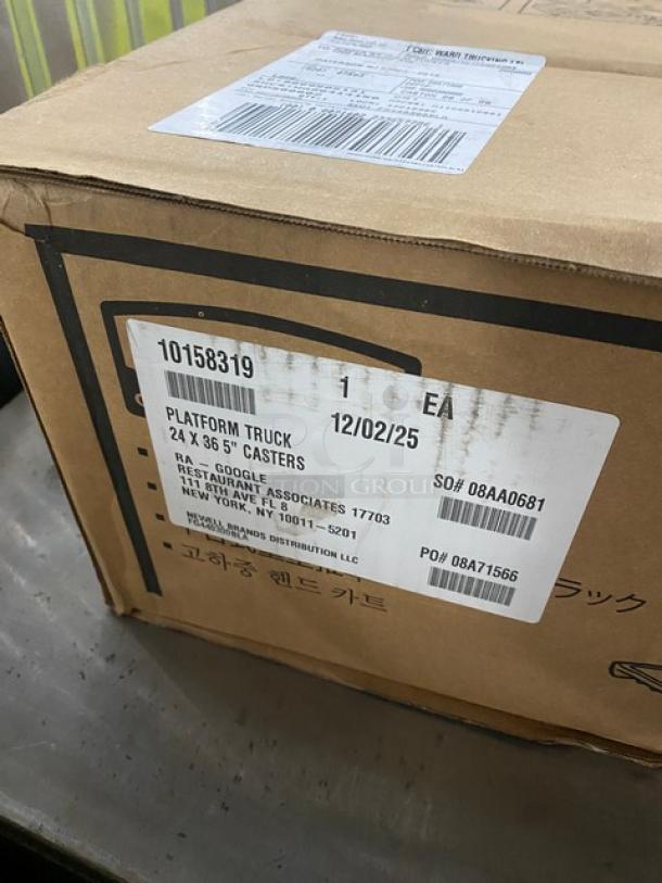 Rubbermaid Commercial Black Heavy-Duty 24"x36" platform truck, model FG440300BLA, with single handle and 5" casters, new condition.