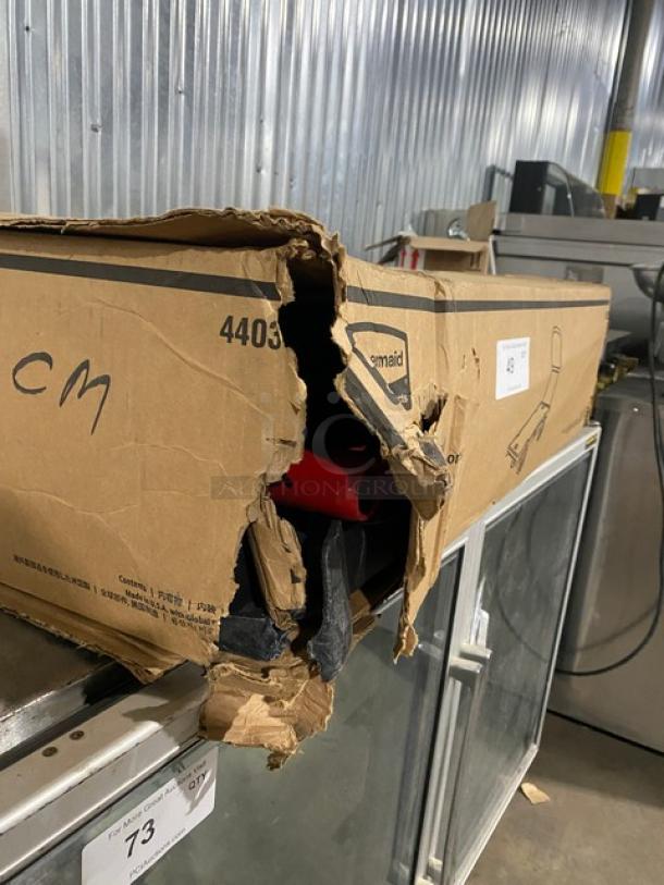 Rubbermaid Commercial Platform Truck, Model FG440300BLA, in damaged box showing the black and red parts.