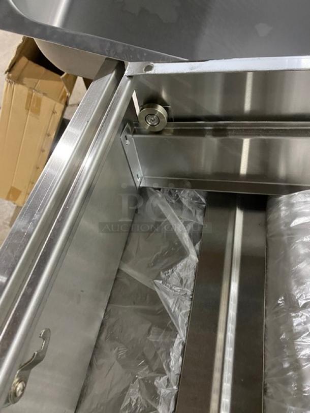 Brand new NBR TDR2020L stainless steel self-closing drawer assembly with lock and key, shown open.