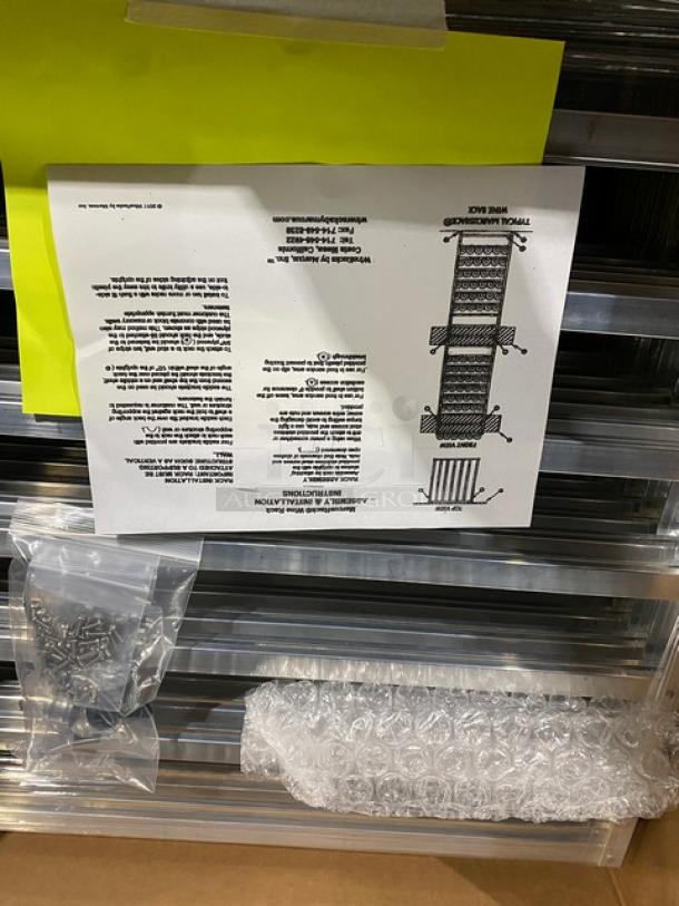 Brand new Marcus Rack stainless steel full-bottle wine shelves, includes packaging and assembly instructions.