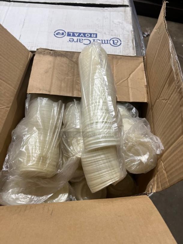 Open box of AmercareRoyal 32 oz. round paper food containers. Items sealed in plastic, brand label on inner box visible.