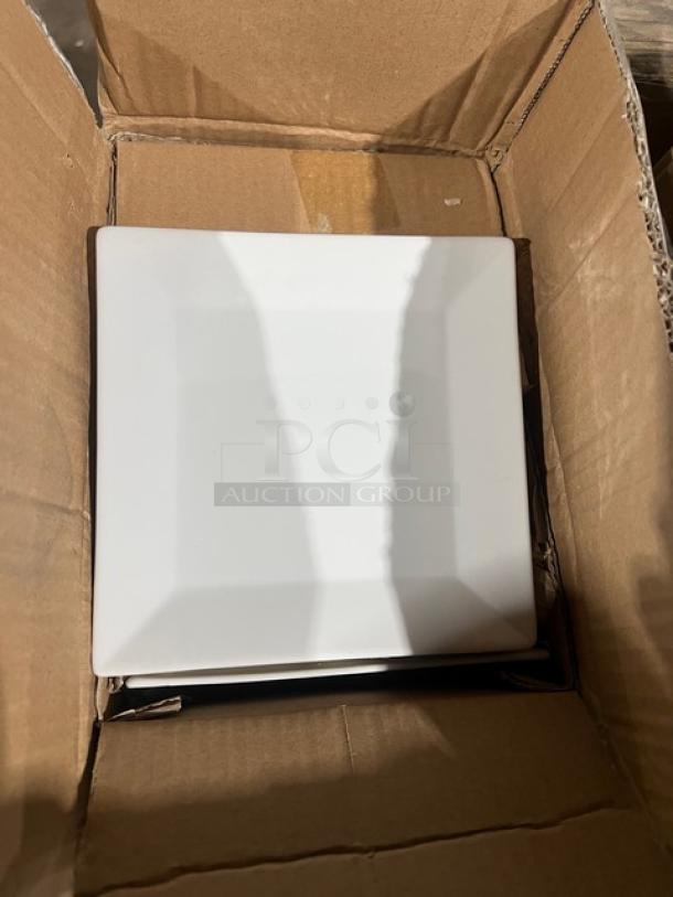 Square porcelain plate from iTi Quad Series, Model QP-18, in an open cardboard box. Bright white, new condition.