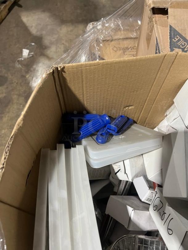 Mixed pallet of commercial kitchen items, including plates, lids, syrup servers, and more, in new condition.