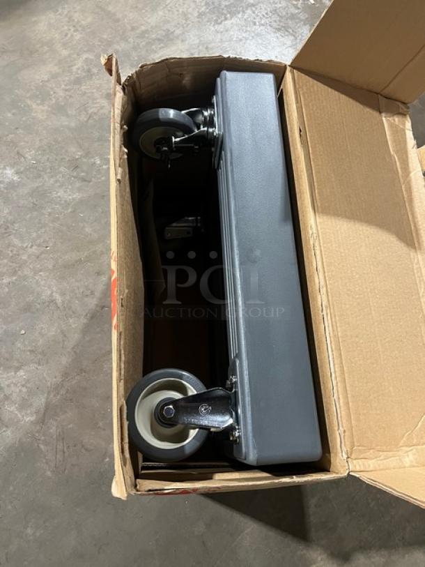 New Cambro CD300615 Camdolly, charcoal gray, heavy-duty pan/food carrier with 350 lb capacity, on casters, in box.