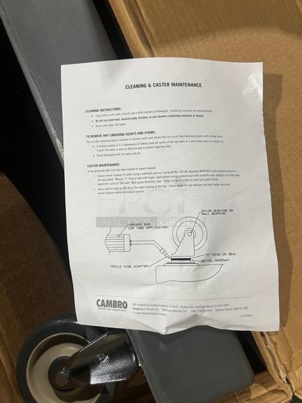 Brand new Cambro Camdolly CD300615, charcoal gray, heavy-duty food carrier with 350 lb capacity, on casters. Includes maintenance sheet.