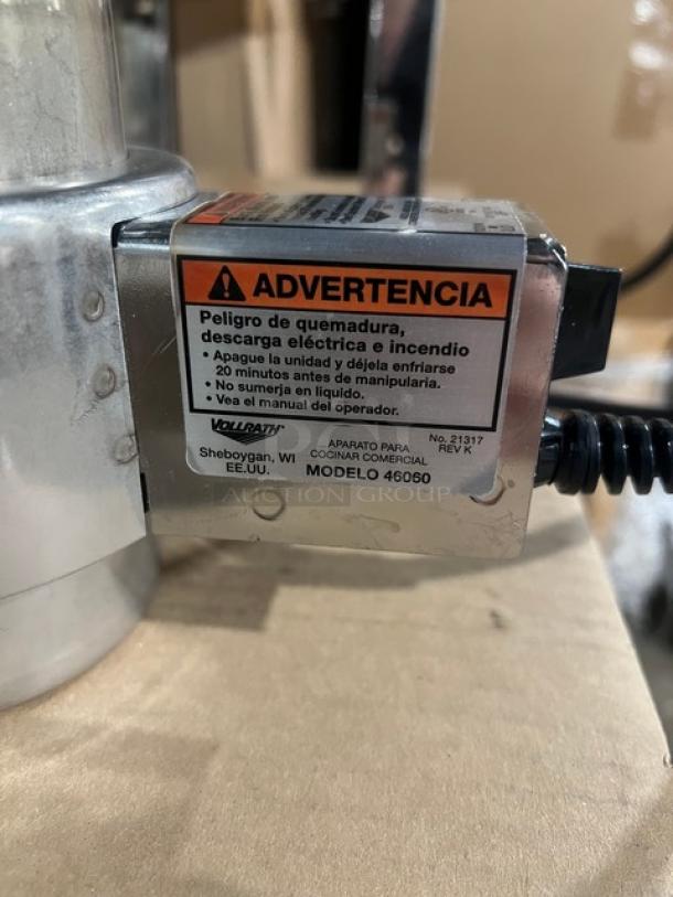 Brand new Steelite black coated tower coffee chafer urn with polished accents, equipped with Vollrath model 46060 electric heater.