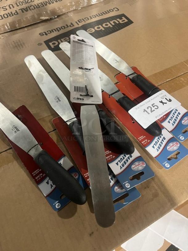 Brand new Winco Winware 10"x1-3/8" stainless steel bakery spatula, model TKPS-9, with black grip handle. Tags attached.