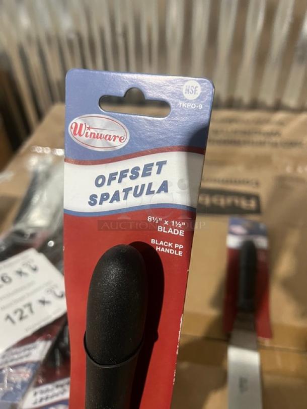 Brand new Winco Winware TKPO-9 stainless steel offset spatula, 8-1/2"x1-1/2", with black PP handle in packaging.