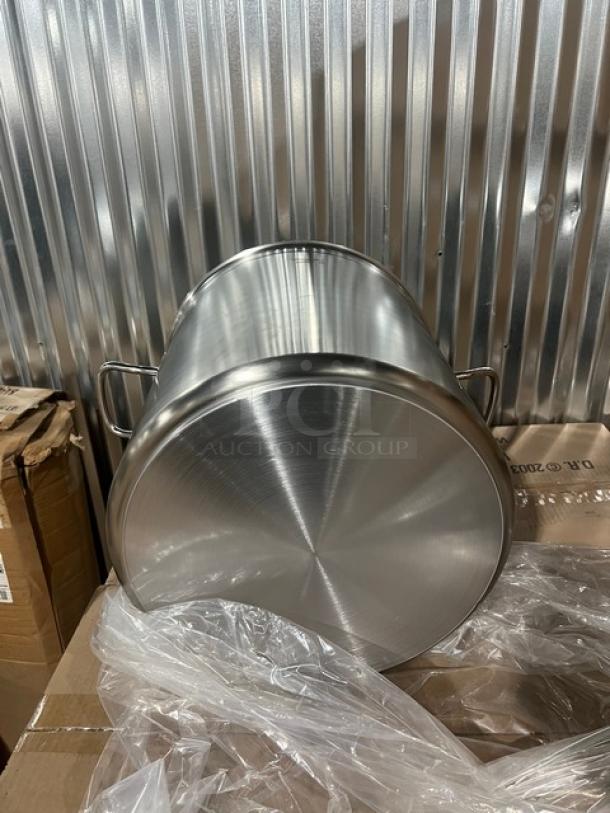 Brand new Vollrath Intrigue Series 53 Qt. stainless steel stock pot, Model 47725, with dual handles and polished finish.