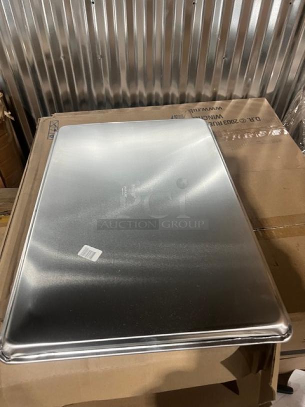 Brand new Vollrath Wear-Ever 9003 commercial aluminum full-size sheet pan on cardboard box.
