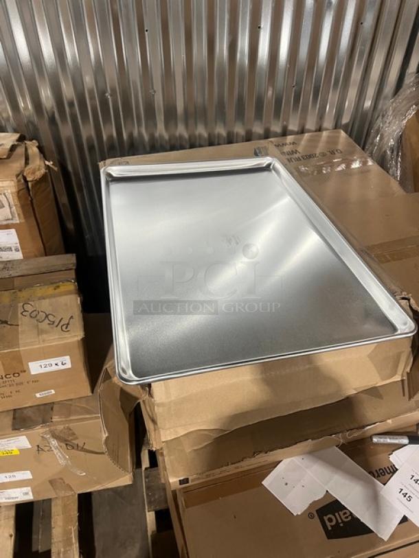 Brand new Vollrath Wear-Ever commercial aluminum bun/sheet pan, model 9003, on cardboard box. Full-size, durable.