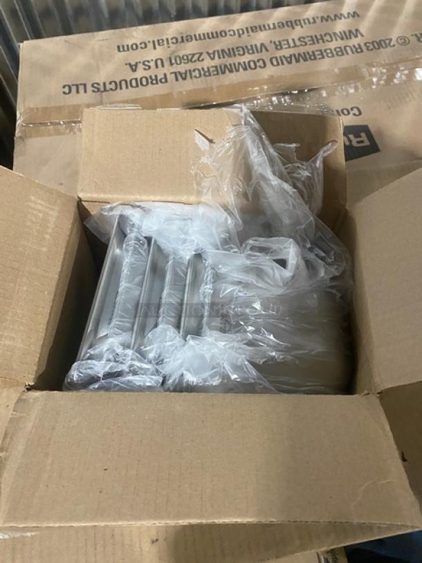 Box of brand new Vollrath Super Pan 3 Series stainless steel 1/6-size, 6" deep anti-jam pans, model 90662, in packaging.