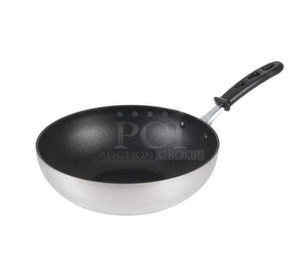 Brand new Vollrath 11" aluminum stir fry pan, model 68120. Features non-stick Steel Coat x3 and black grip handle.