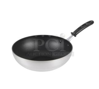 Brand new Vollrath 11" aluminum stir fry pan, model 68120. Features non-stick Steel Coat x3 and black grip handle.