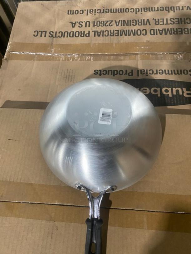 Brand new Vollrath 11" round aluminum non-stick stir fry pan, model 68120, with Steel Coat x3 and black grip handle.