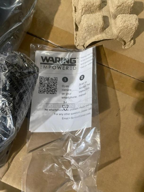 Brand new Waring Quik Stik Series WSB33X, 7" stainless steel, two-speed immersion blender in packaging with label and QR code.