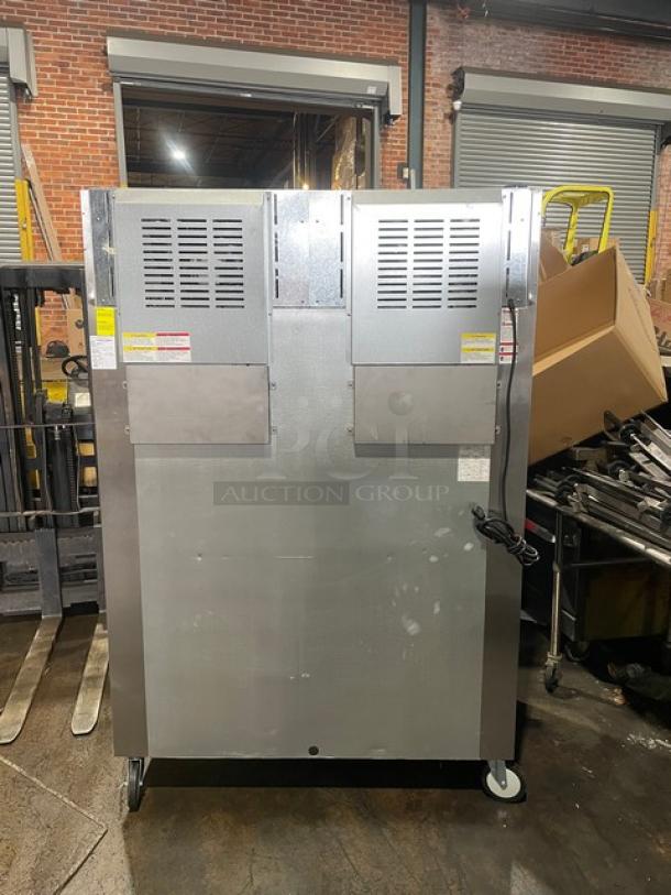 Beverage-Air 54" stainless steel 2-door reach-in freezer, model TMF2HC-1S, like new, on casters, includes poly-coated wire rack.