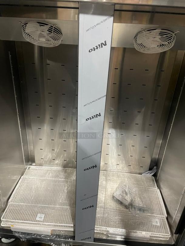 Beverage-Air 54" stainless steel top-mount freezer, model TMF2HC-1S. Like new, poly-coated wired rack, on casters.