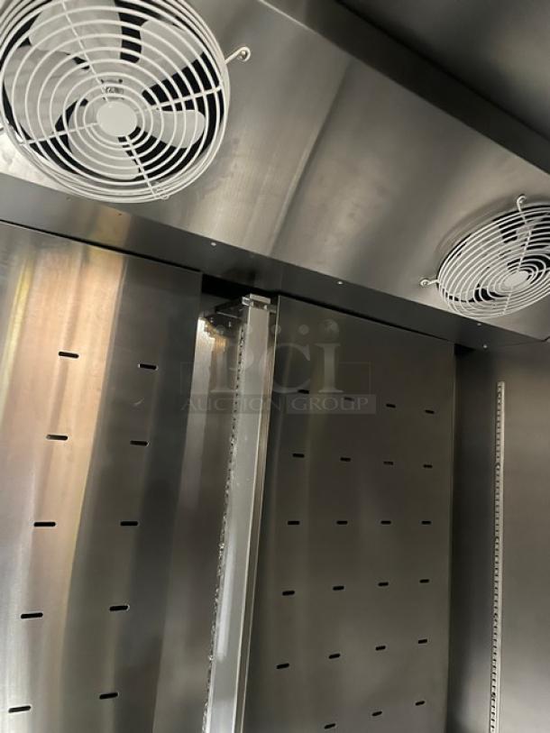 Beverage-Air TMF2HC1S stainless steel 2-door reach-in freezer interior, featuring dual fans and poly-coated racks. Like new condition.