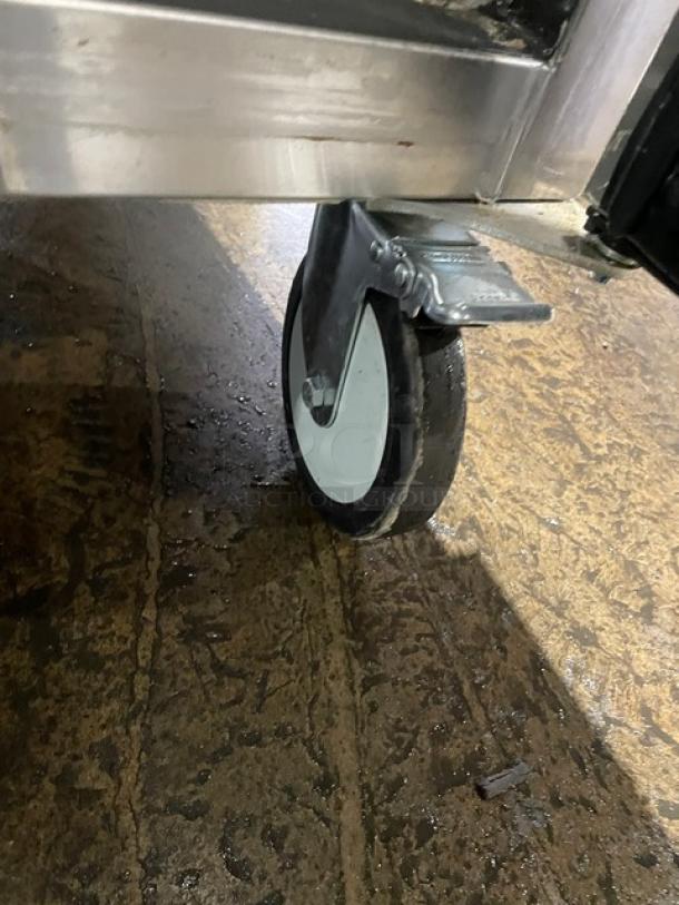 Beverage-Air TMF2HC-1S freezer caster on a wet floor, showcasing stainless steel construction.