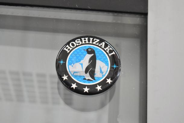 Brand logo of Hoshizaki RM-65-HC commercial cooler. Features a penguin with icebergs, illustrating cooling efficiency.
