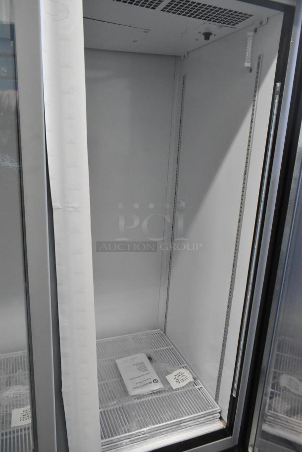 Brand new 2026 Hoshizaki RM-65-HC commercial 3-door cooler, 115V, 1 Phase, empty interior, with visible Hoshizaki label.