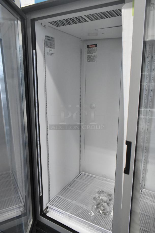 Brand new Hoshizaki RM-65-HC commercial 3-door reach-in cooler, 115 volts, 1 phase, pristine condition, interior view.