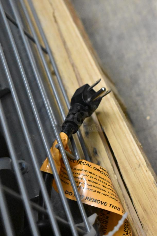 Power cord of brand new Hoshizaki RM-65-HC commercial cooler with grounding warning tag, 115 volts, 1 phase.
