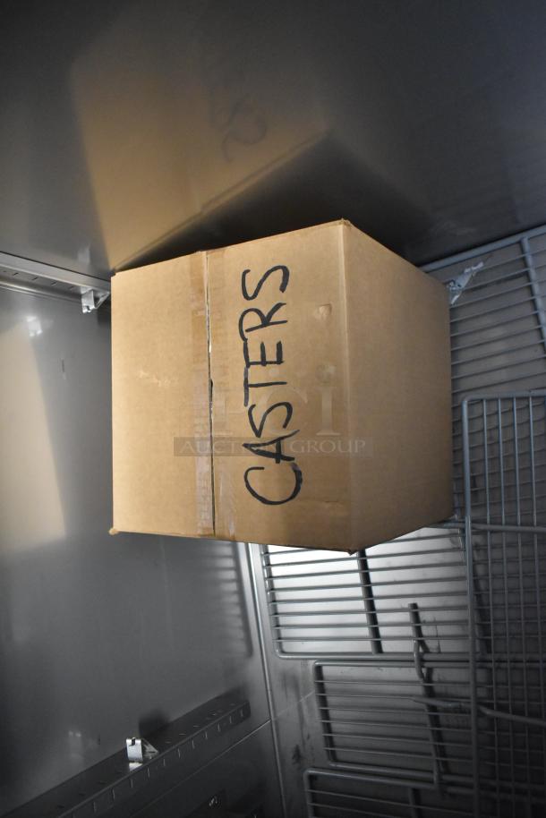 Cardboard box labeled "CASTERS" inside Hoshizaki R3A-FS cooler. New condition, commercial 3-door reach-in, 115V, 1-phase.