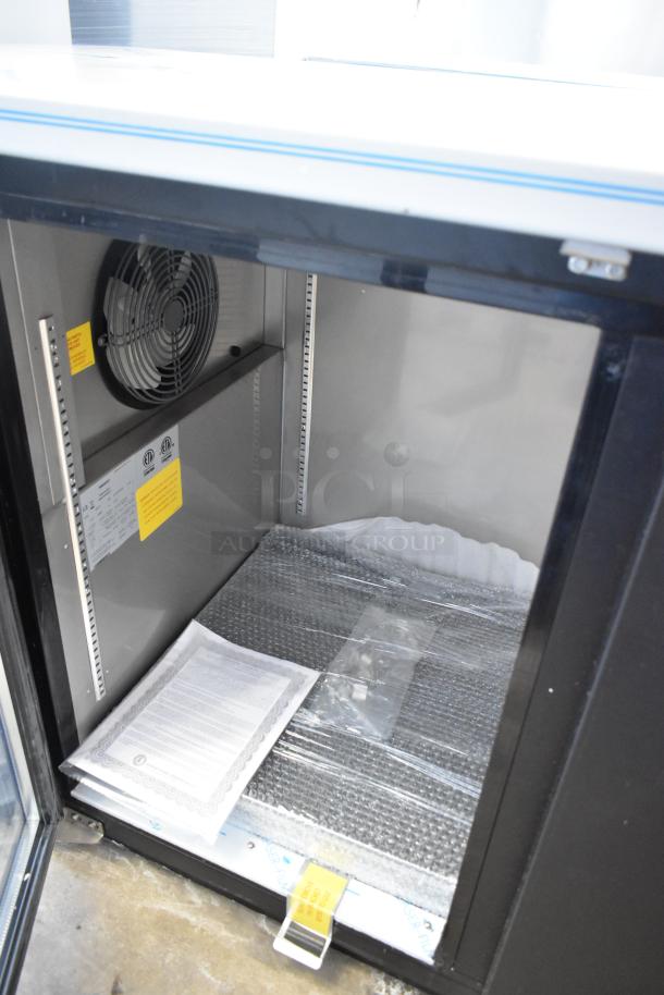 Brand new 2022 Hoshizaki BB95-G commercial 3-door back bar cooler, 115 volts, 1 phase, interior view with fan and documents.