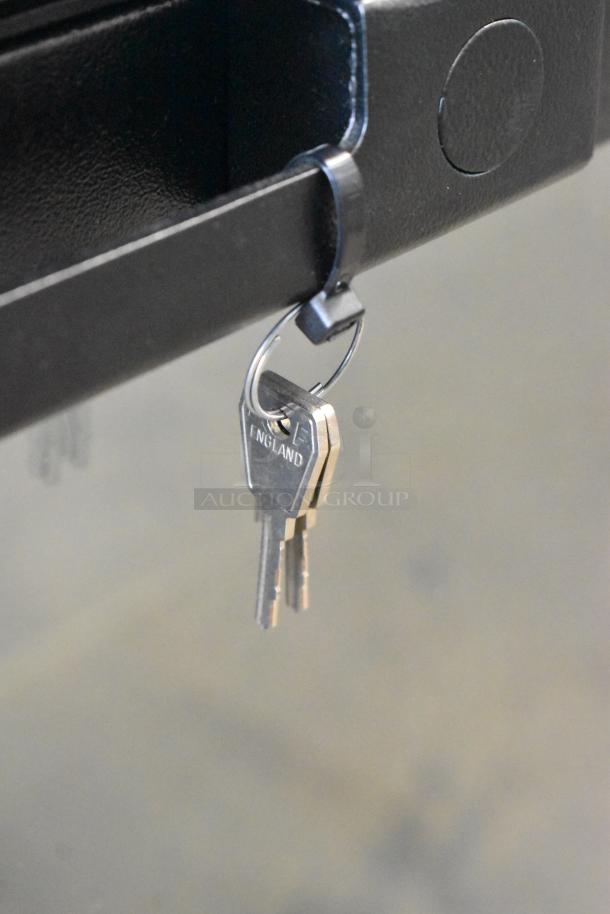 Keys hanging on a hook for the 2022 Hoshizaki BB95-G Commercial Back Bar Cooler, new condition.