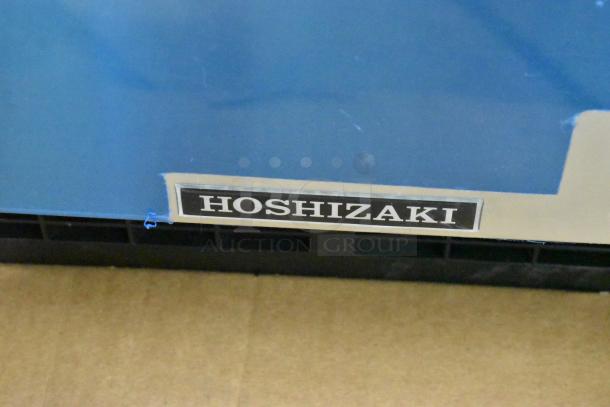 Brand new 2024 Hoshizaki AM-50BAJ-DS icemaker, 115V, 1 phase, in original packaging. Hoshizaki label visible.