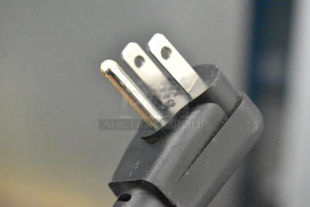 Close-up of a three-prong power plug for the Hoshizaki AM-50BAJ-DS icemaker, showing new condition.