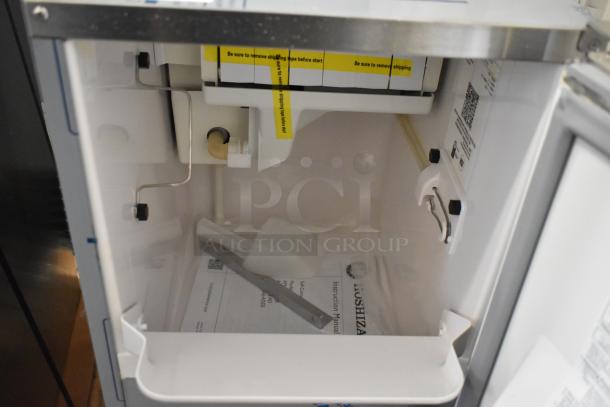 Brand new Hoshizaki AM-50BAJ-DS commercial icemaker, 115V, 1 phase, with interior shot showing labels and instructions.