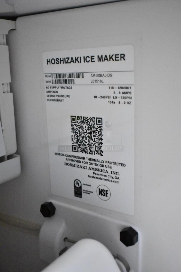 Brand new Hoshizaki AM-50BAJ-DS commercial ice maker tag, 115V, showing model, serial number, specifications, and approval labels.