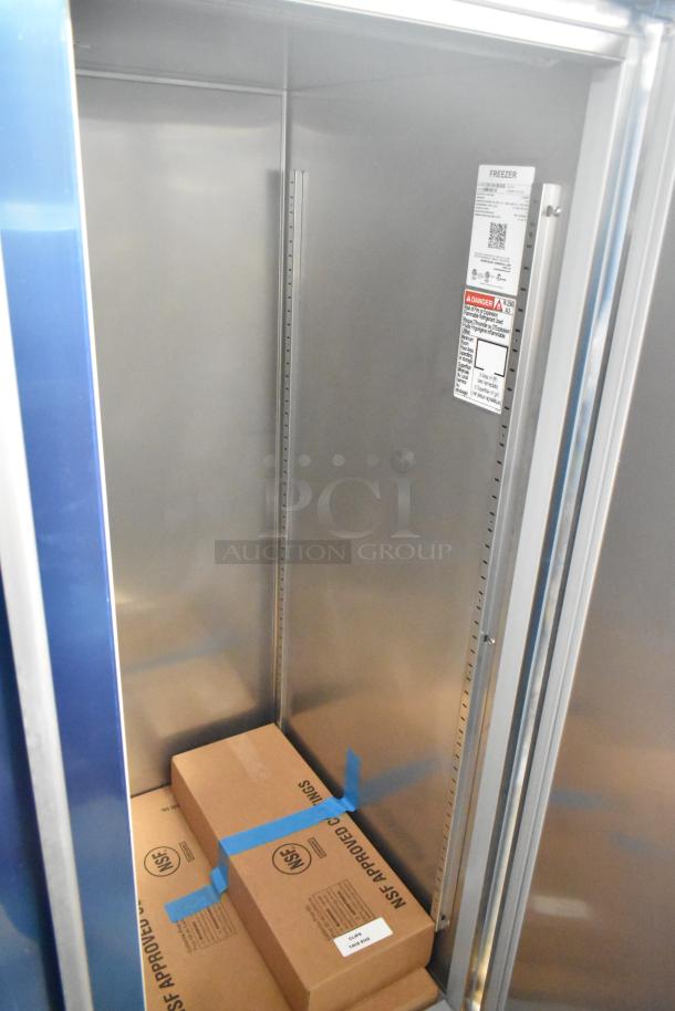 Brand new 2025 Hoshizaki F2A-FS 2-door reach-in freezer, 115V, 1 phase, interior view with labels and shelves.