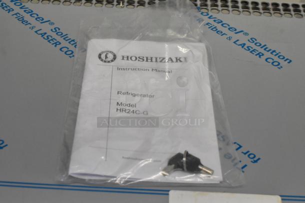 Instruction manual and keys for brand new Hoshizaki HR24C-G commercial undercounter cooler. Model HR24C-G visible.