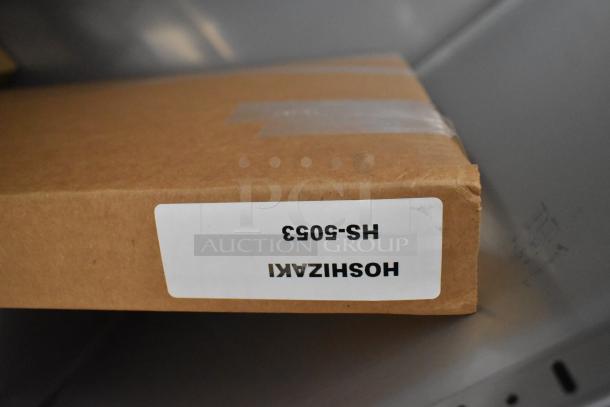 Cardboard box with label "Hoshizaki HS-5053," part of the 2026 Hoshizaki F1A-FSL commercial freezer. Brand new condition.