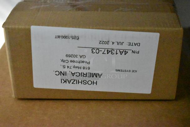 Cardboard box labeled "Hoshizaki America Inc., Ice Systems" with parts info, Peachtee City GA address, and July 2022 date.