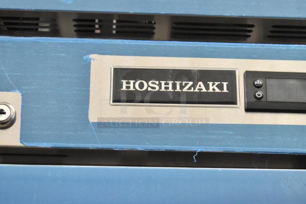 Brand new Hoshizaki R1A-FS cooler, single door, 115V, 1 phase, model label visible, pristine condition.