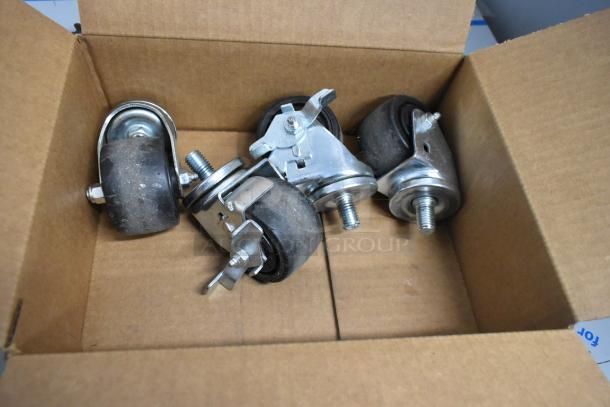 Box containing four casters for a Hoshizaki PT1A-FS-FS cooler. Casters have black rubber wheels and metal fixtures.
