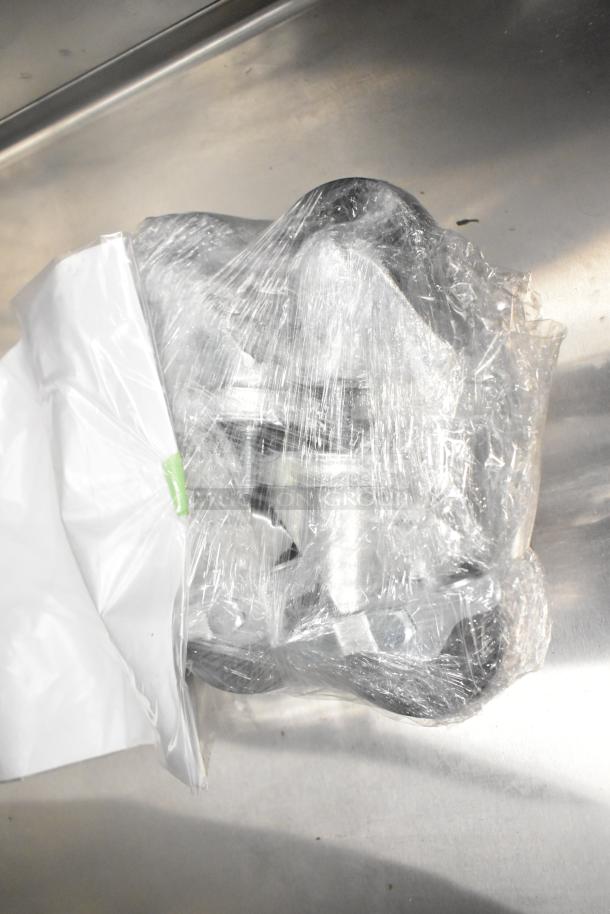 Brand new 2025 Hoshizaki ER1A-FS cooler merchandiser with commercial casters wrapped in plastic, 115V, 1 phase.