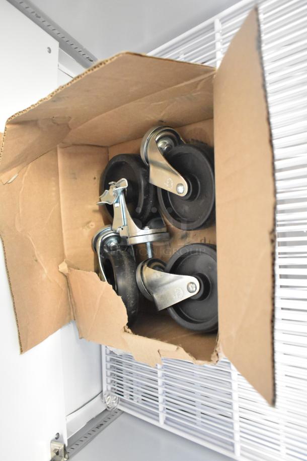 Box of commercial casters for 2025 Hoshizaki ER1A-FS single door cooler, new condition, with metal mounting plates.