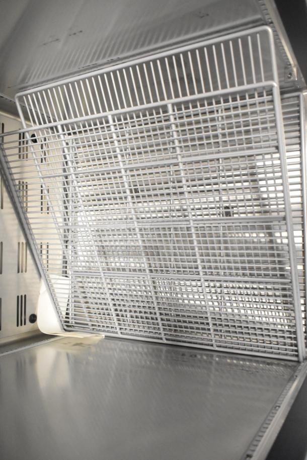 Brand new 2026 Hoshizaki VR1A-FS Valiance commercial single door reach-in cooler, interior view, metal shelving.